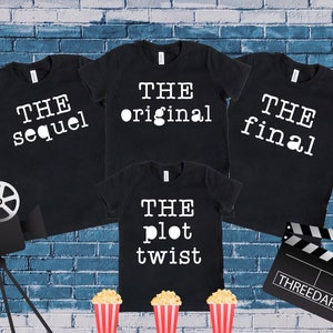 May include: Four black t-shirts with white text. The shirts read "The original", "The sequel", "The final", and "The plot twist".