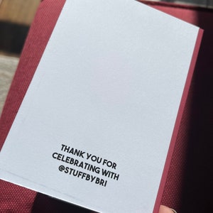 May include: White card with black text that says "Thank you for celebrating with @stuffbybri"