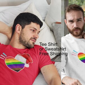 Gay Trans Pride Heart with Santa hat design. Gay Christmas tee shirt or sweatshirt with rainbow colors. Gay pride, Trans Pride, Holidays