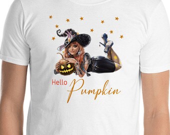May include: White t-shirt with a graphic of a witch holding a pumpkin and the text "Hello Pumpkin" in gold lettering.
