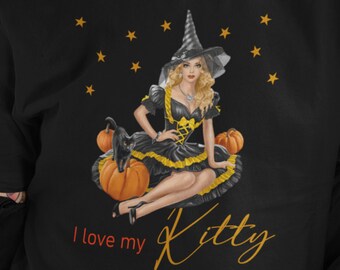 May include: Black t-shirt with a graphic of a witch sitting on pumpkins. The witch is wearing a black dress with a yellow belt and a black hat. The text "I love my Kitty" is printed below the graphic.
