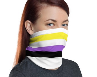 May include: A white face mask with yellow, white, purple, and black stripes. The mask is worn by a person with red hair.