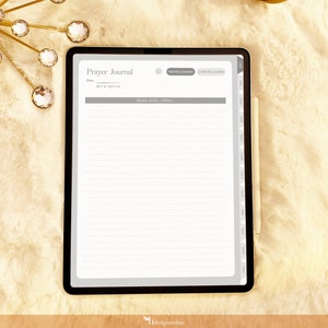 May include: A white iPad with a gray border displaying a digital prayer journal app. The app has a gray header with the text "Prayer Journal" and a section for writing prayers labeled "Dear God, I pray..."