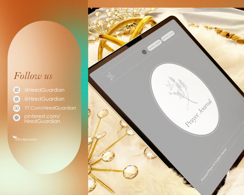 May include: A gray tablet with a white circle on the screen. The circle has a line drawing of a sprig of leaves and the text "Prayer Journal". The tablet is on a white fluffy surface with gold decorative items.