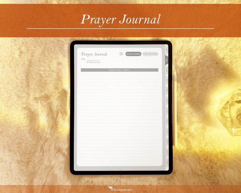 May include: A digital tablet displaying a prayer journal template with the text "Prayer Journal" and "Dear God, I Pray". The tablet is on a white fuzzy surface.