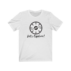 May include: White t-shirt with a black compass graphic and the text "Let's Explore!"
