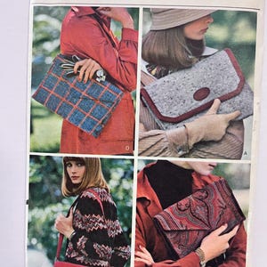 May include: Vogue Patterns 5974 sewing pattern envelope featuring four clutch and shoulder bag designs. The images display a blue plaid clutch, a grey speckled clutch with red trim, a red shoulder bag, and a dark paisley print clutch.