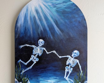 May include: An arched canvas painting depicting two white skeletons swimming underwater, holding hands. The scene features deep blue water, light rays filtering from above, and green aquatic plants growing among rocks at the bottom of the frame.