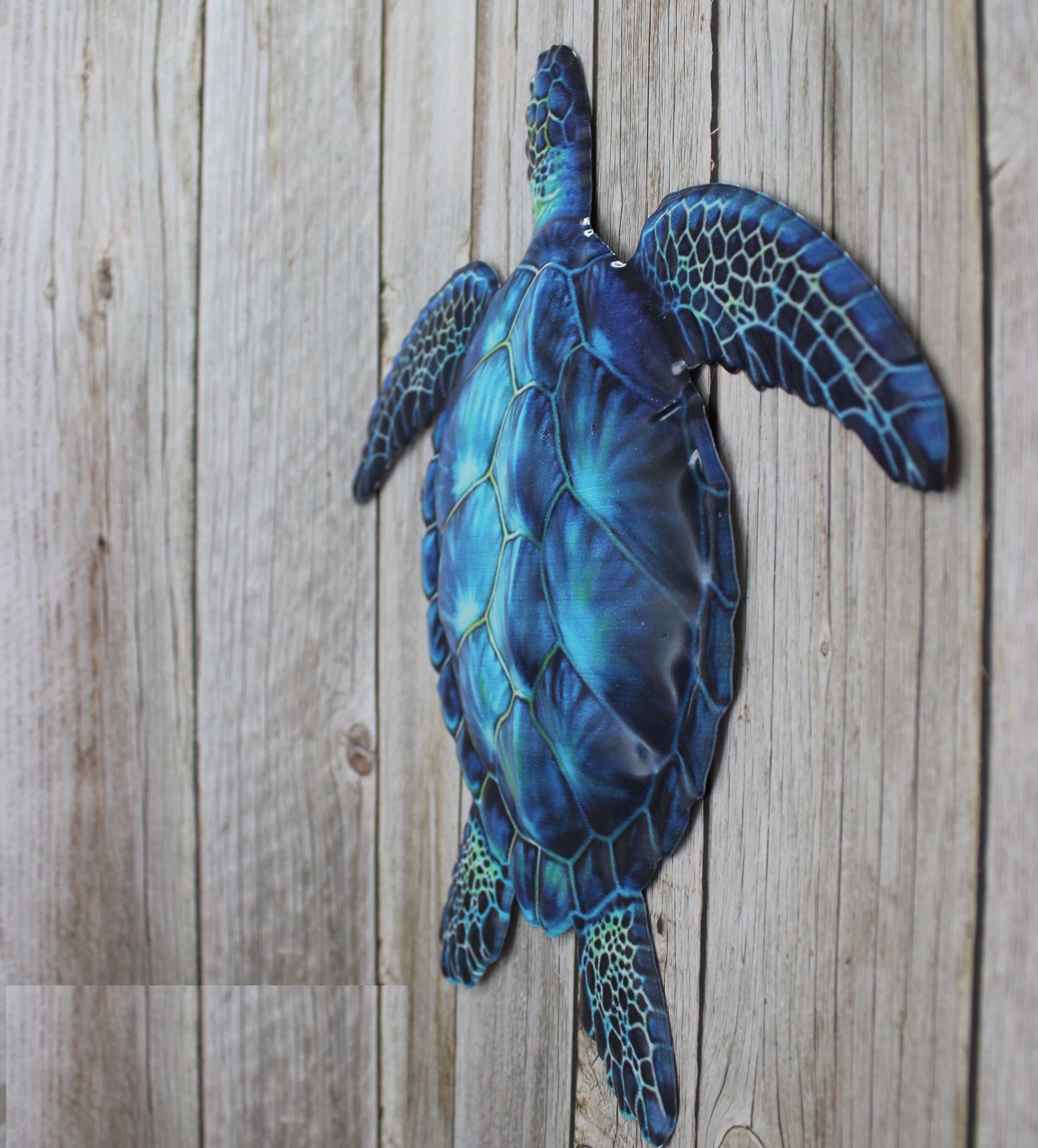 decoration murale en métal un banc de tortues bleus