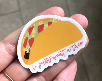 May include: A yellow and white sticker with a cartoon taco and the text "I just want a taco".