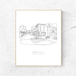 May include: A black and white line drawing of a street scene in Tree Hill, North Carolina. The drawing features a building with a sign that reads "Go Tree Hill Ravens".