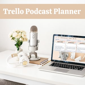 May include: A workspace setup featuring a laptop displaying a podcast planner, a silver microphone, white headphones, and a bouquet of white flowers. The text "Trello Podcast Planner" is at the top of the image.