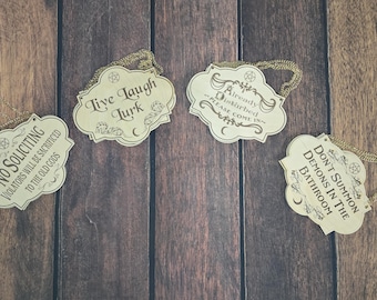 witchy wall hangings, no soliciting, already disturbed, live laugh lurk, demons in bathroom