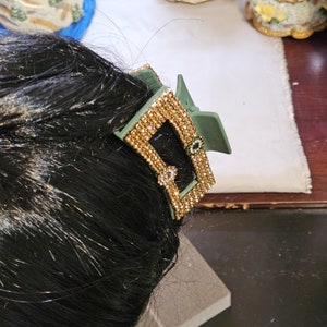Pinza para el pelo decorada con cristales de bronce y flores de cristal.