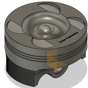 Puede incluir: Un pistón de metal gris con un centro hundido y tres ranuras alrededor de la parte superior. El pistón tiene el texto "Parker Engineering" impreso en el lateral.