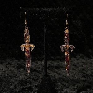 gold and red sword earrings
