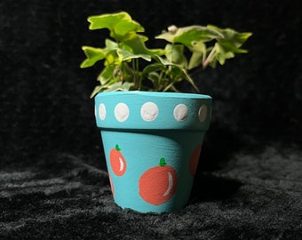 handbeschilderde sinaasappelplanter