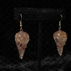 red and gold realistic bird skull earrings