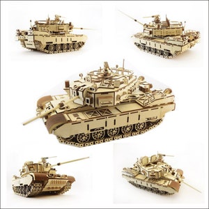 May include: A wooden model kit of a tank. The tank is made of laser-cut plywood and is assembled with glue. The tank is shown in five different poses, with the turret facing different directions. The tank is a detailed model with many intricate parts.