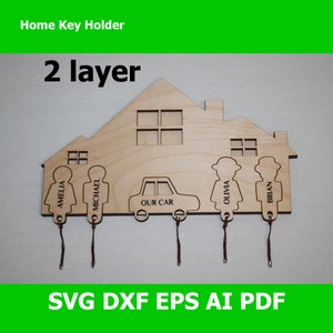 May include: A wooden home key holder with cutouts for five keys. The home is two-layered and has a car, two female figures, and two male figures. The names Amelia, Michael, Our Car, Olivia, and Brian are engraved on the key holders.
