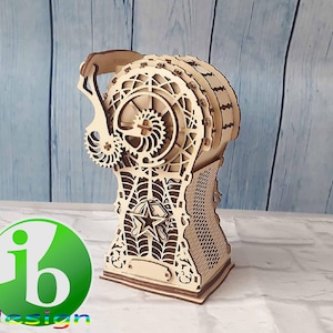 May include: A wooden 3D puzzle in the shape of a steampunk-style gear mechanism. The puzzle is made of laser-cut wood and features intricate details. The puzzle is assembled and ready to be displayed.