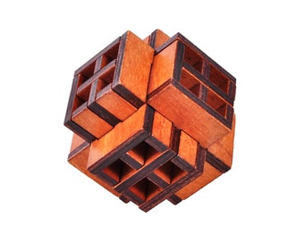 May include: A wooden puzzle cube with a complex, interlocking design. The cube is constructed from multiple rectangular wooden pieces, creating a three-dimensional structure with open spaces. The wood has a warm, reddish-brown hue with darker edges.