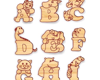 May include: Wooden alphabet blocks with animal illustrations. Each block features a different letter of the alphabet and a corresponding animal, such as a cow for B, an elephant for E, and a lizard for I.