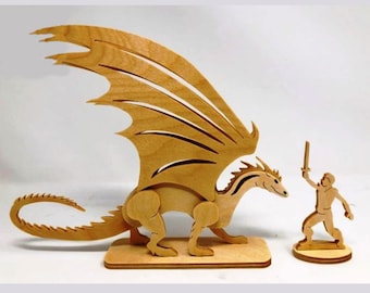 May include: A wooden dragon figurine with outstretched wings and a small wooden warrior figurine holding a sword. The dragon is brown and the warrior is light brown.