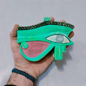 Amulet in the form of the protective eye of Horus, great protection. 6 x 4.5 inches Made in Egypt