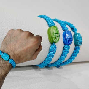 Scarab bracelet. Egyptian scarab and wool bracelet, adjustable size. Scarab bracelet for luck and wealth. Available in three colors