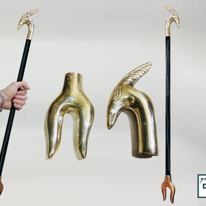 May include: Two gold-toned walking stick handles, one shaped like a bird's head and the other like a forked branch. The handles are shown next to a black walking stick with a gold-toned bird's head handle.