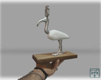 A similar ver. A small statue of the god Thoth depicted as an ibis.