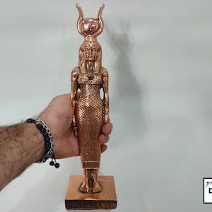 The statue of the goddess Hathor, the goddess of the sky,  the statue of the copper washing is available in two sizes. Made in Egypt