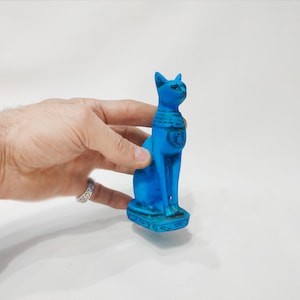 The statue of the goddess Bastet, the protection of the goddess Isis.the protection of the Egyptian scarab, a wonderful statue,made in egypt
