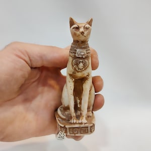An ancient Egyptian statue of the goddess Bastet, the statue of the cat Bastet. Statue of Bastet. made in egypt