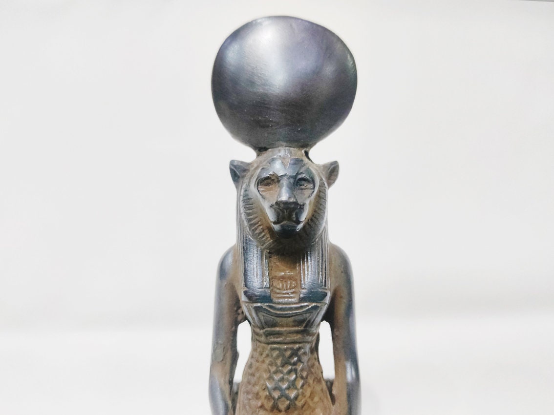 A seated statue of the goddess Sekhmet of solid stone. A rare museum copy. Distinguished altar statue . 6 inches. Made in Egypt