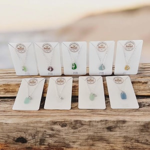 May include: A set of three ceramic mugs with a speckled, matte finish. The mugs are in shades of cream, light gray, and dark gray. Each mug has a simple, minimalist design, perfect for coffee or tea.