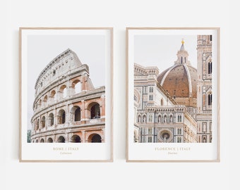 May include: Two framed prints of Italian landmarks. The left print shows the Colosseum in Rome, Italy. The right print shows the Duomo in Florence, Italy.
