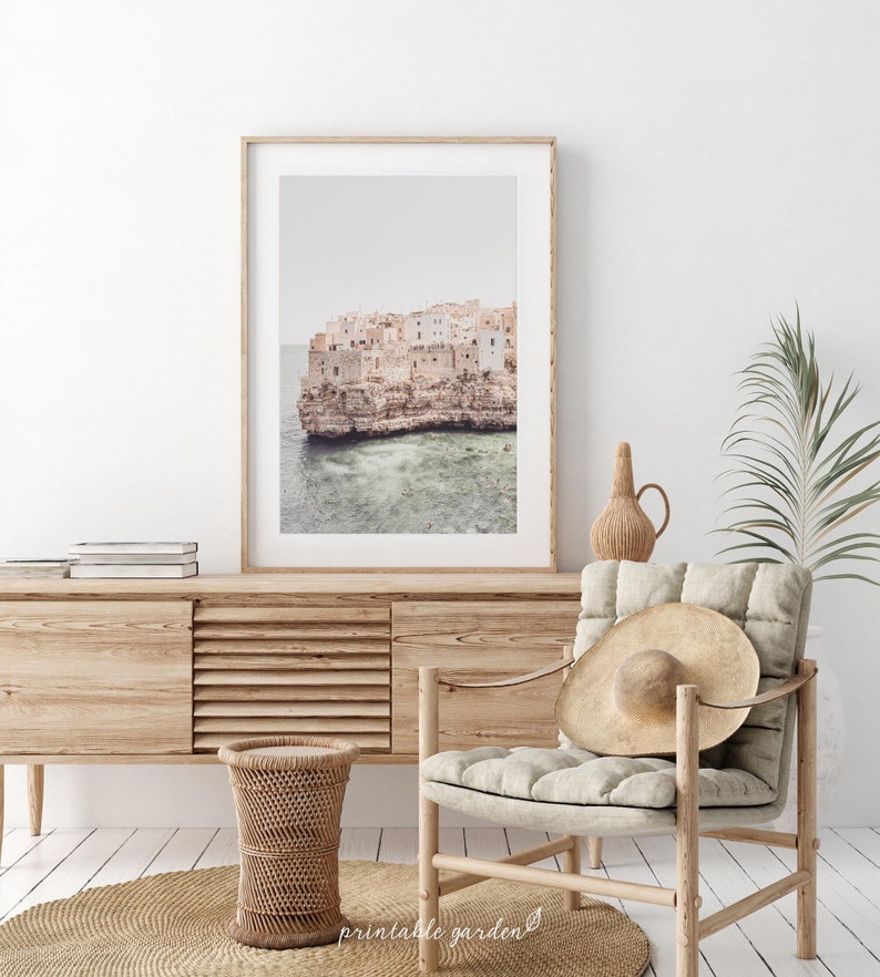 Printable wall art of italian Village, a whitewashed coastal village in southern Italy built on bright cliffs above turquoise sea. Mediterranean travel print in soft, luminous tones. High-resolution JPG digital download.