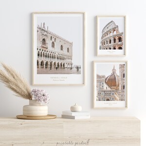 May include: Three framed prints of iconic Italian landmarks. The top left print features the Doge's Palace in Venice, the top right print features the Colosseum in Rome, and the bottom print features the Duomo in Florence. Each print includes the city name and landmark name in a minimalist font.