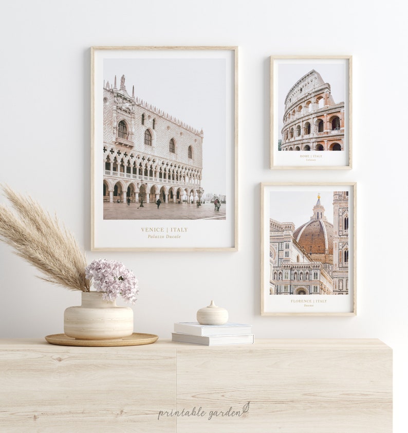 May include: Three framed prints of iconic Italian landmarks. The top left print features the Doge's Palace in Venice, the top right print features the Colosseum in Rome, and the bottom print features the Duomo in Florence. Each print includes the city name and landmark name in a minimalist font.