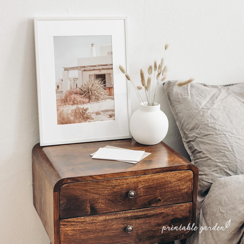 Printable wall art trio with Mediterranean countryside views: whitewashed house with canopy, dirt path through an olive grove, and plant detail. Neutral, rustic artwork perfect for cozy, travel-inspired interiors.