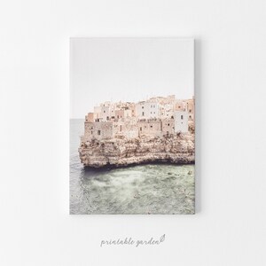 Digital download print of an Italian coastal village in Puglia. White facades on cliffs overlooking the sea evoke Mediterranean charm and wanderlust. Ideal for travel lovers and coastal décor.