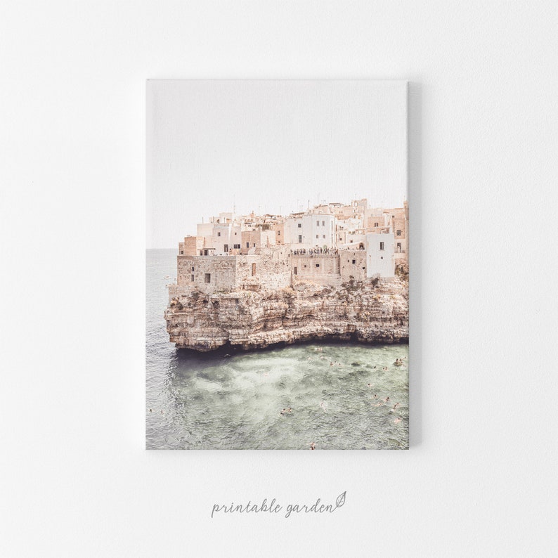 Digital download print of an Italian coastal village in Puglia. White facades on cliffs overlooking the sea evoke Mediterranean charm and wanderlust. Ideal for travel lovers and coastal décor.