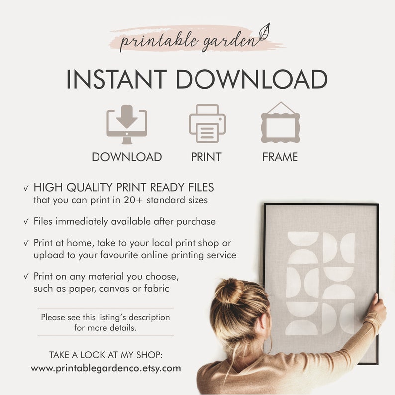 May include: Printable wall art featuring a geometric design with white shapes on a gray background. The art is framed in a black frame and is being held by a person. The text "INSTANT DOWNLOAD" is at the top of the image. The text "DOWNLOAD, PRINT, FRAME" is below the image. The text "HIGH QUALITY PRINT READY FILES that you can print in 20+ standard sizes" is below the text "FRAME". The text "Files immediately available after purchase" is below the text "HIGH QUALITY PRINT READY FILES". The text "Print at home, take to your local print shop or upload to your favourite online printing service" is below the text "Files immediately available after purchase". The text "Print on any material you choose, such as paper, canvas or fabric" is below the text "Print at home, take to your local print shop or upload to your favourite online printing service". The text "Please see this listing's description for more details." is below the text "Print on any material you choose, such as paper, canvas or fabric". The text "TAKE A LOOK AT MY SHOP: www.printablegardenco.etsy.com" is below the text "Please see this listing's description for more details."