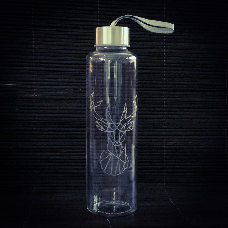 Hand-engraved borosilicate glass bottle