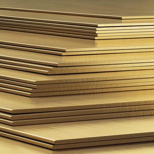 May include: A stack of brass sheets, each with a brushed finish, creating a warm, metallic look.
