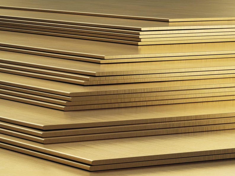 May include: A stack of brass sheets, each with a brushed finish, creating a warm, metallic look.