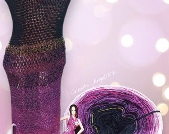 May include: A handmade, crochet dress in a gradient of black, brown, and purple. The dress has a scoop neckline and a fitted silhouette. A ball of yarn in matching colors is next to the dress. The image also includes the text "Credits Angelika" and "Boa Hancock".