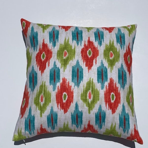 Pair of Coral/Teal Ikat print decorator pillow. 20x20 throw pillow